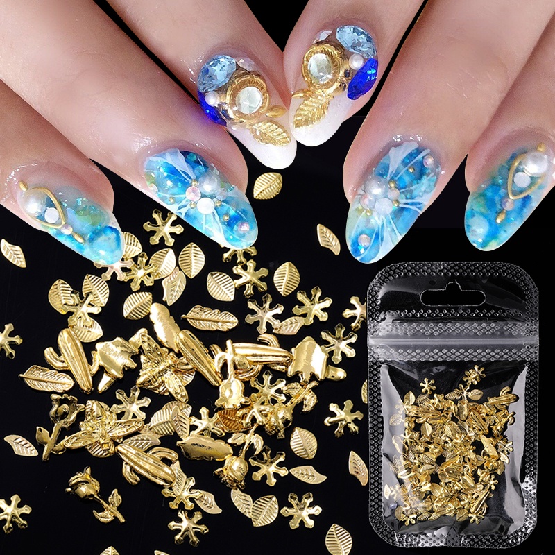 1 Kotak Aksesoris Dekorasi Nail Art DIY Bentuk Kerang / Bintang Laut / Daun Warna Emas / Silver Metalik