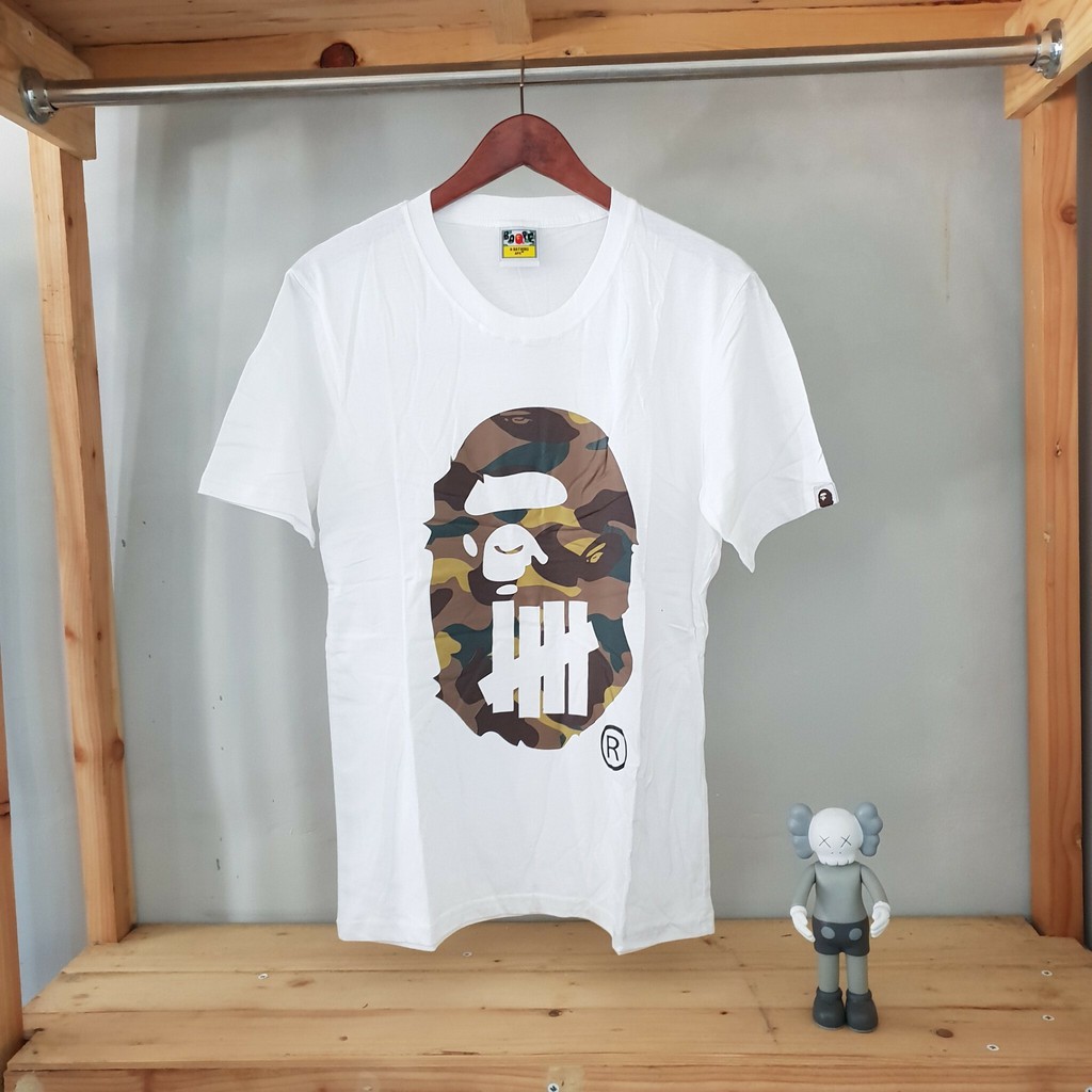1132 BAJU KAOS TSHIRT BAPE A BATHING APE X UNDEFEATED BIG HEAD CAMO BROWN WHITE KAOS BAPE BAJU BAPE