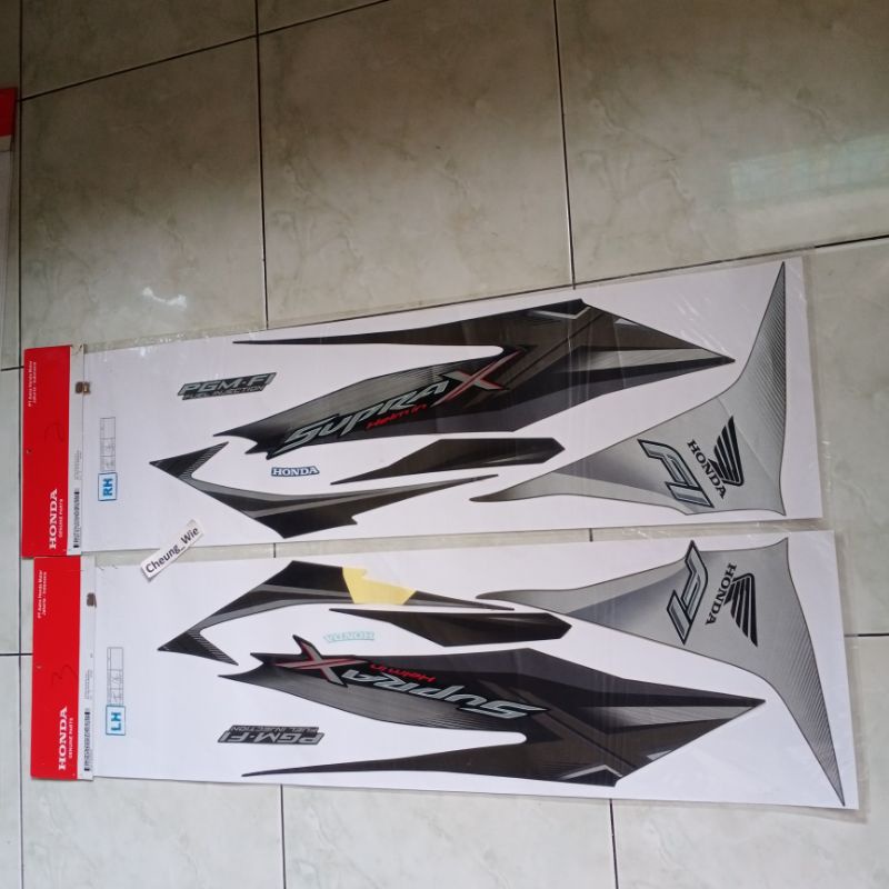 871X0KYZ660ZCL & 871X0KYZ660ZCR lis body Striping Stiker Supra X 125 Helm in F1 2013 Coklat ori AHM