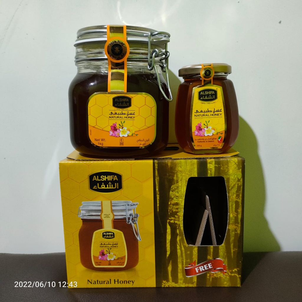 

Paket Madu Al Shifa Natural Honey 1 kg + 250 gr Paket Hemat Gratis Bonus Kemasan Botol Kaca Hampers Herbal Asli Murni Ori Impor Arab