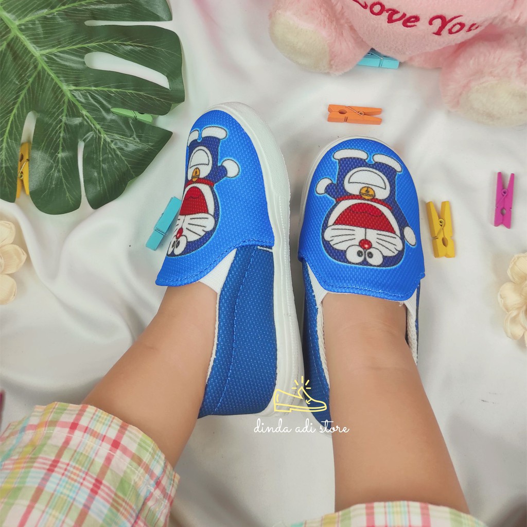 DINDA SEPATU SLIP ON ANAK PEREMPUAN DORAEMON CUTE REBORN UKURAN 26-35 WARNA BIRU