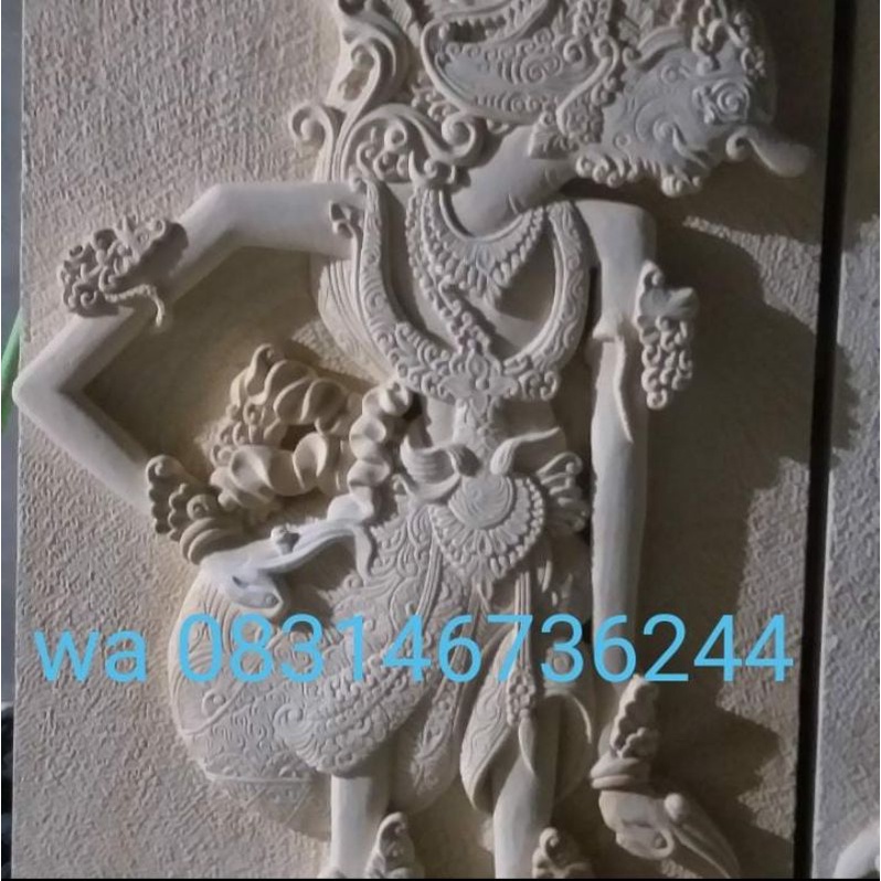 relief batu alam motif wayang