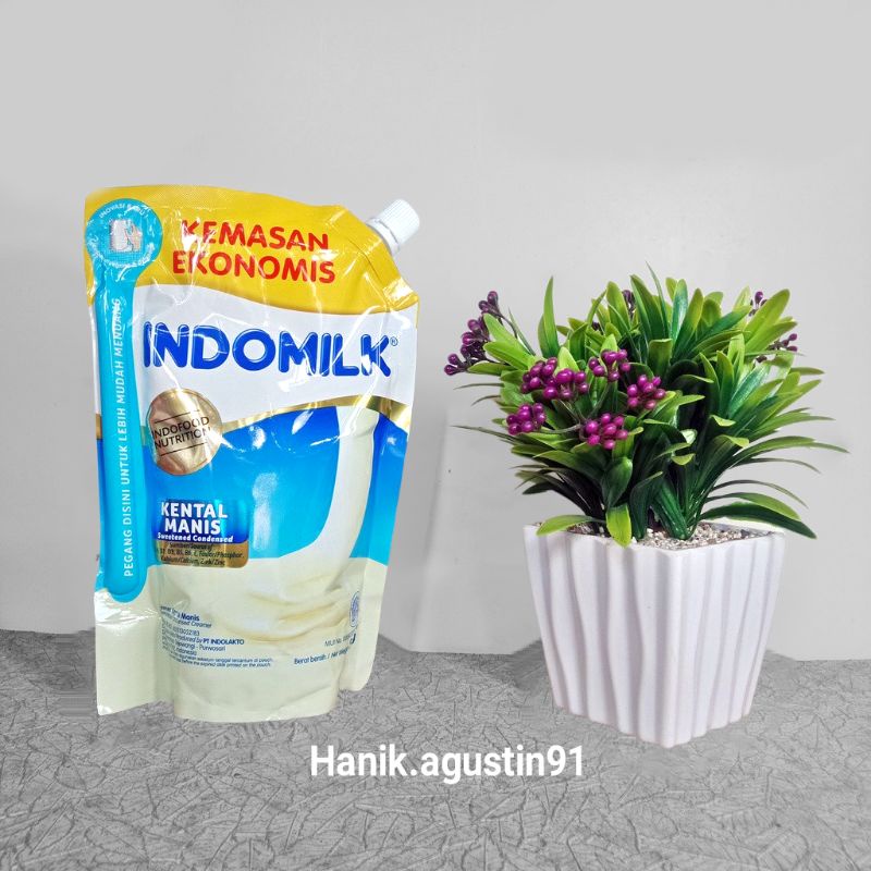 

Susu Kental Manis Indomilk Pouch Kemasan Ekonomis Pegangan Putih 545 gram