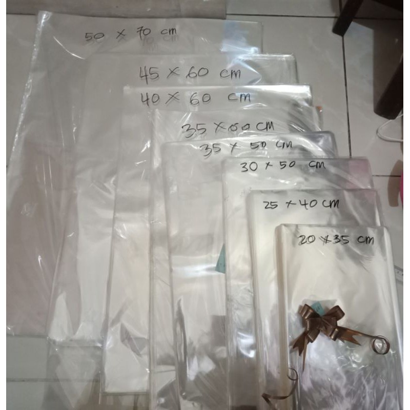 

Kantong Plastik Parcel Kado Bening Polos Tebal Ulang Tahun Anak Pita Tarik Cantik Kawat Twisted