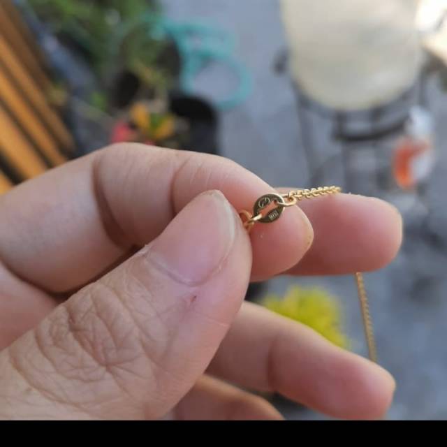 Emas kadar 875%.1.12 gram