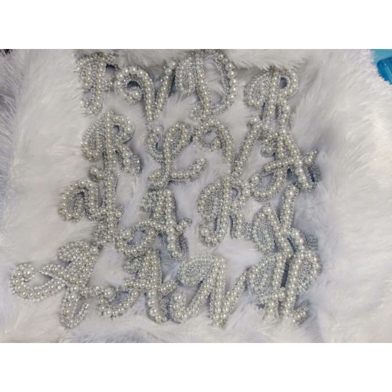 Quinmika bros huruf mutiara