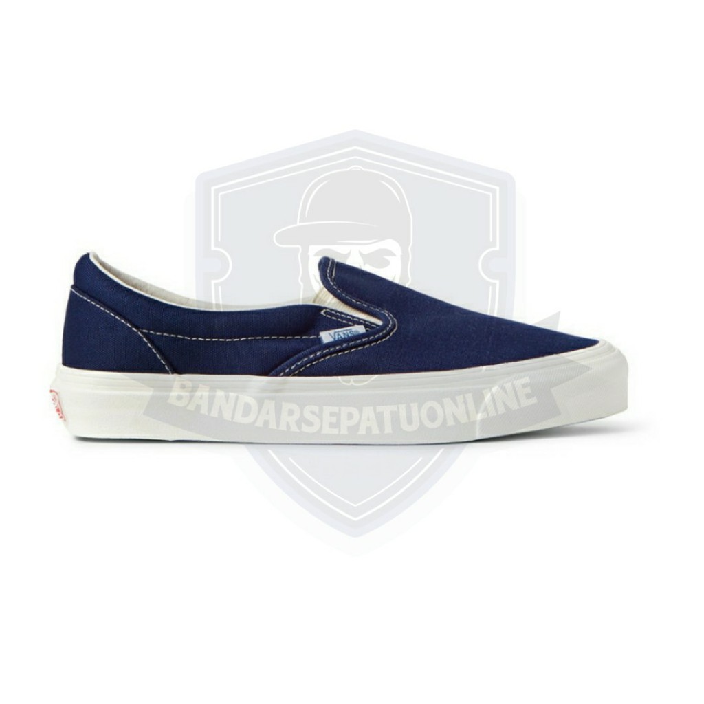 navy vans slip ons
