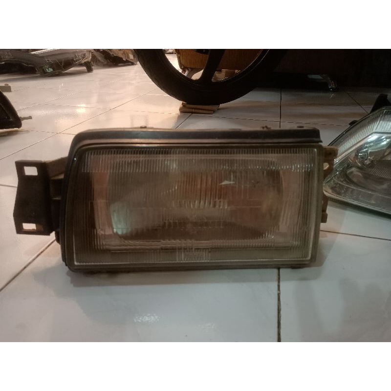 headlamp mazda 323 kanan original