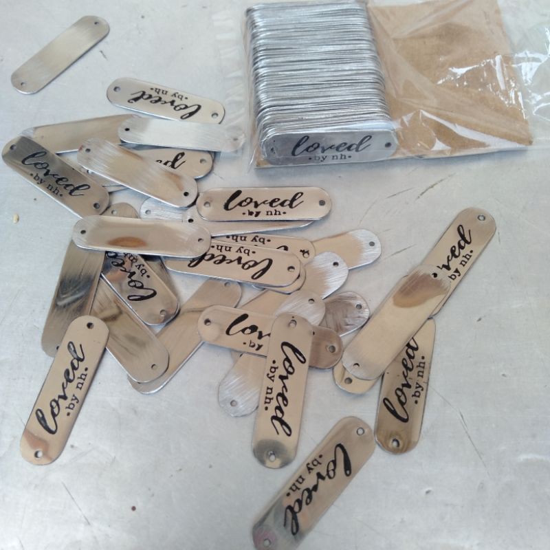 

Label plat silver tulisan hitam ukuran 4 x 1