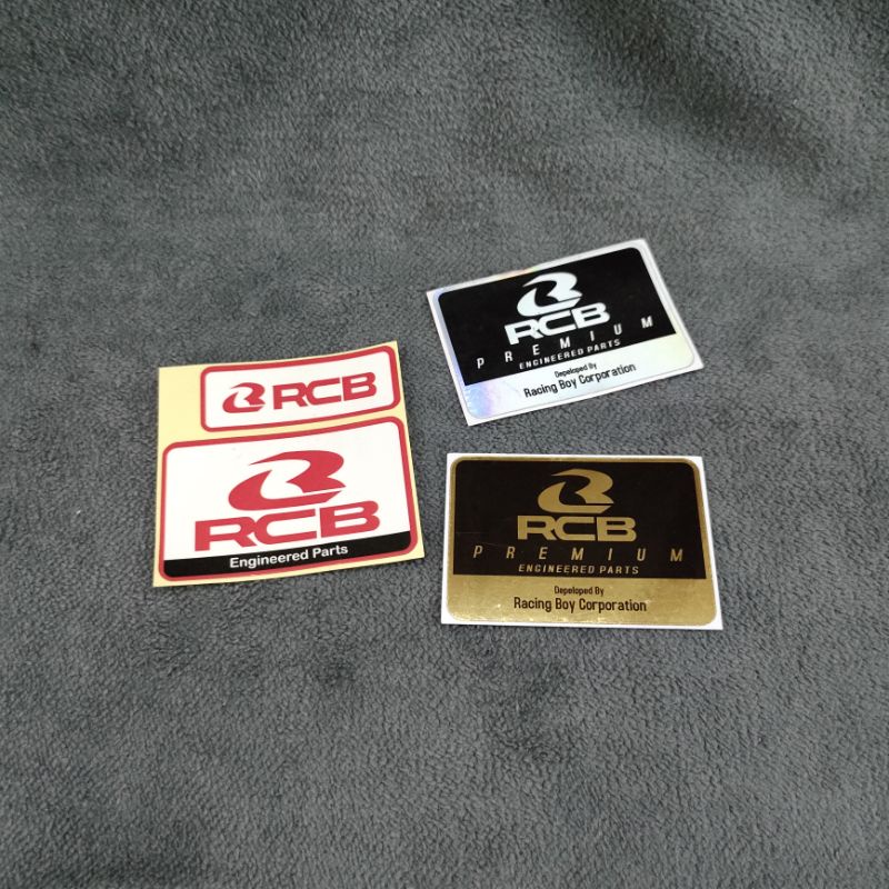 sticker shock rcb racing boy merah gold hologram stiker sok rcb