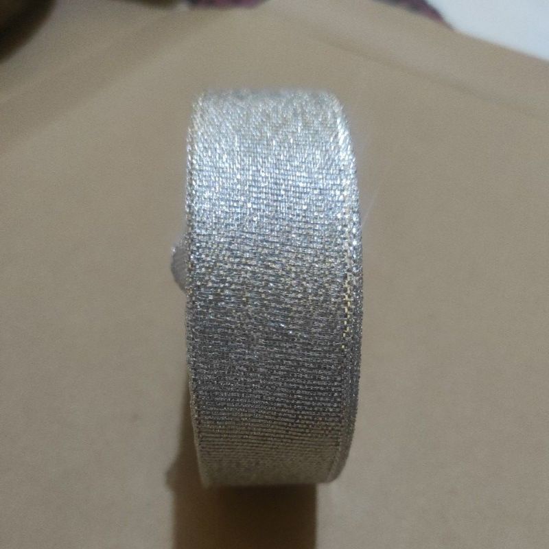 

pita perak 1" / lebar 2,5 cm