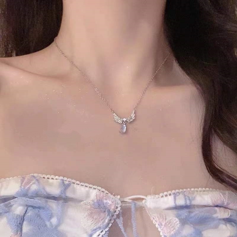 Kalung Rantai Klavikula Desain Sayap Aksen Moonstone Gaya Korea Untuk Wanita