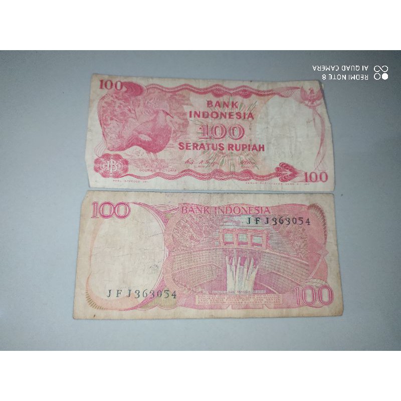 uang kuno Rp 100 burung goura kondisi bekas