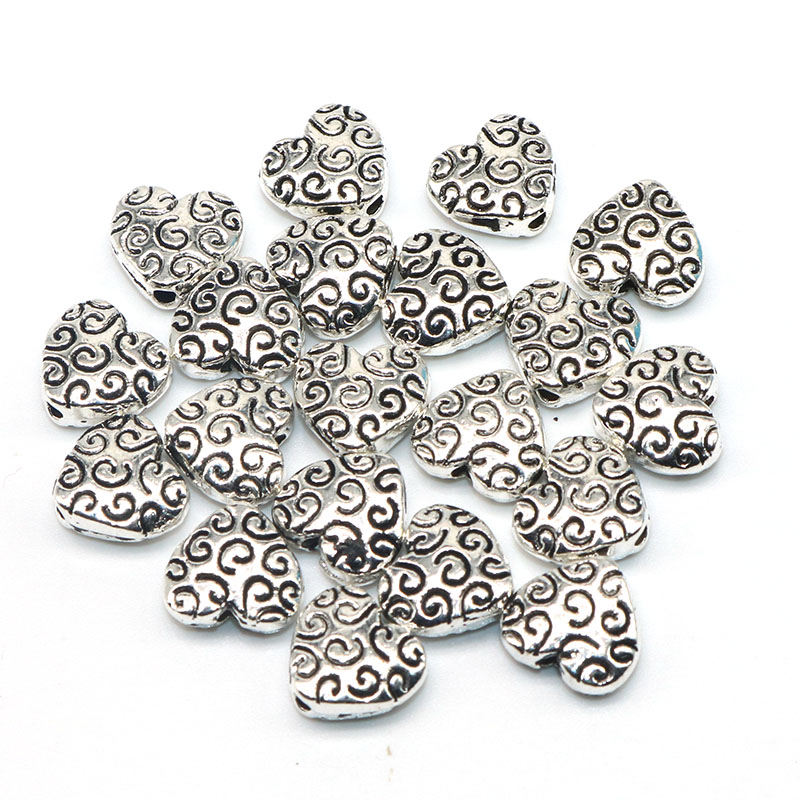 20pcs / lot Manik-Manik Spacer Bentuk Hati Warna Silver Bahan Metal Ukuran 8mm Untuk Gelang