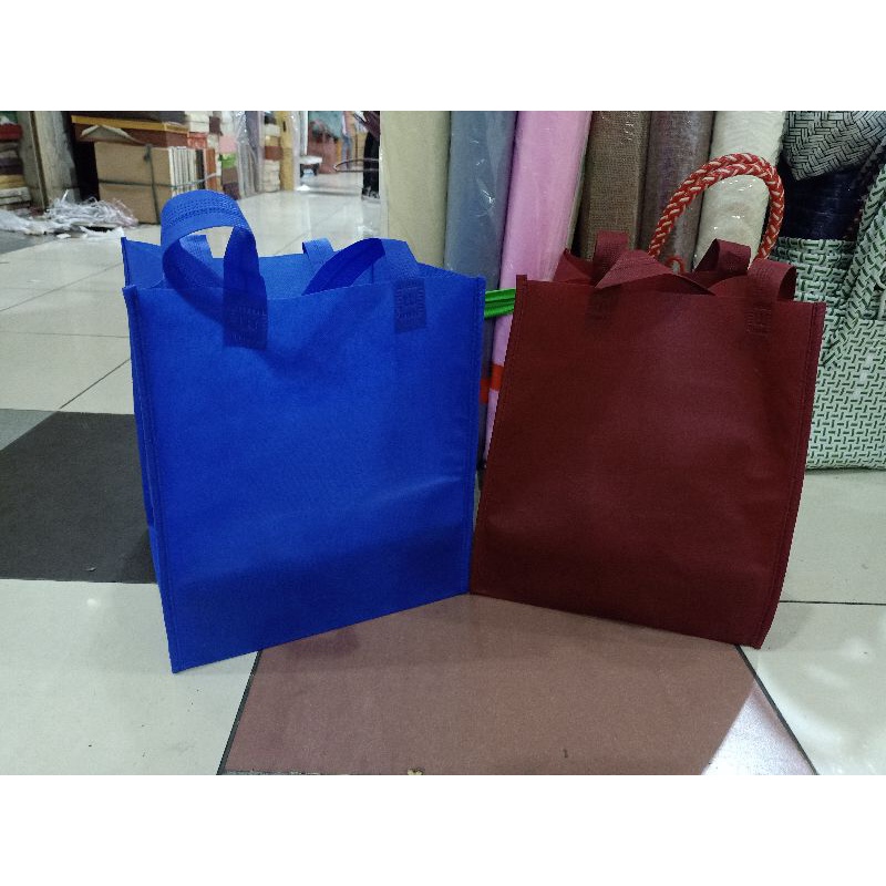 

tas kain spunbond buat nasi kotak 22 isi 12 pcs terlaris dan termurah