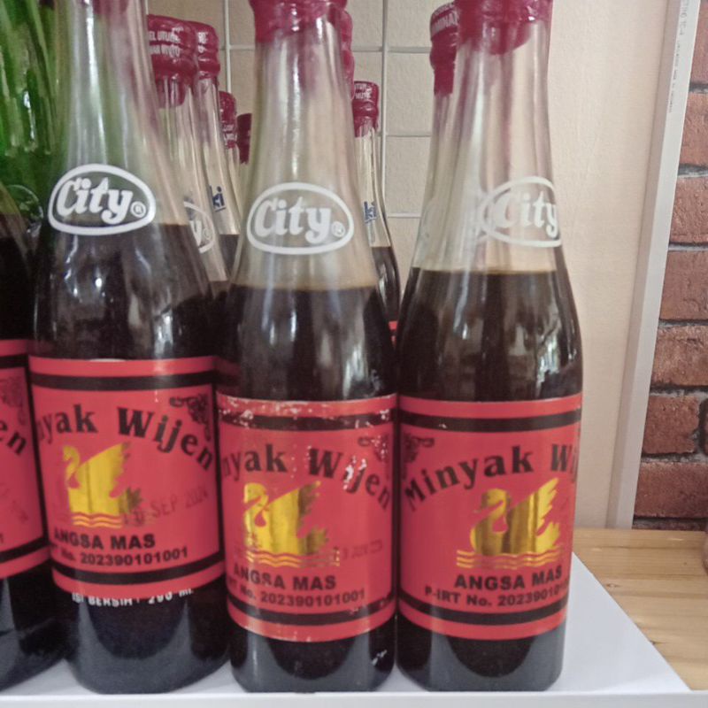 

MINYAK WIJEN CAP ANGSA MAS/ASLI BANGKA BELINYU