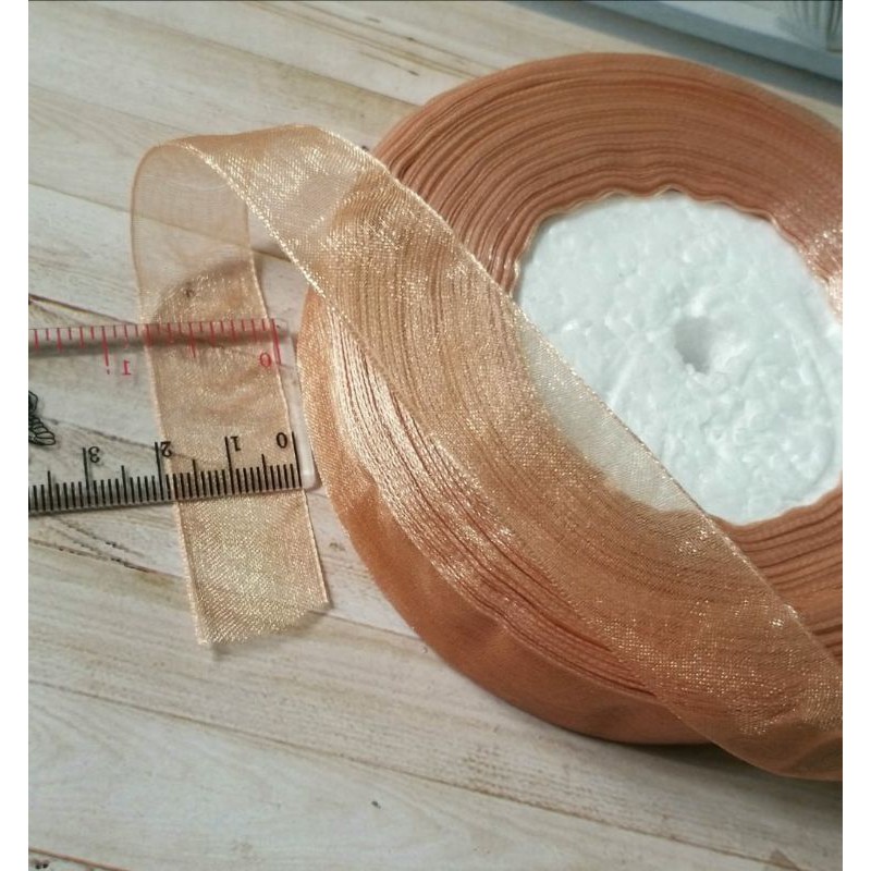 

per rol 50yard/45meter,pita organdi warna coklat mas lebar 1.8cm