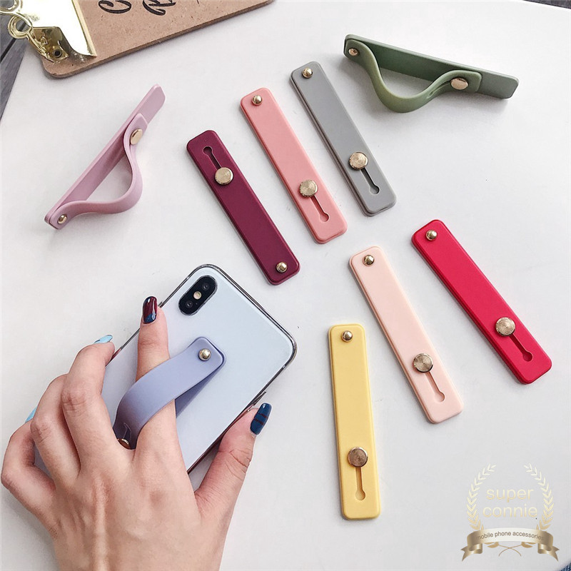 Stand Holder Smartphone Universal Bahan Silikon Dengan Strap Pergelangan Tangan