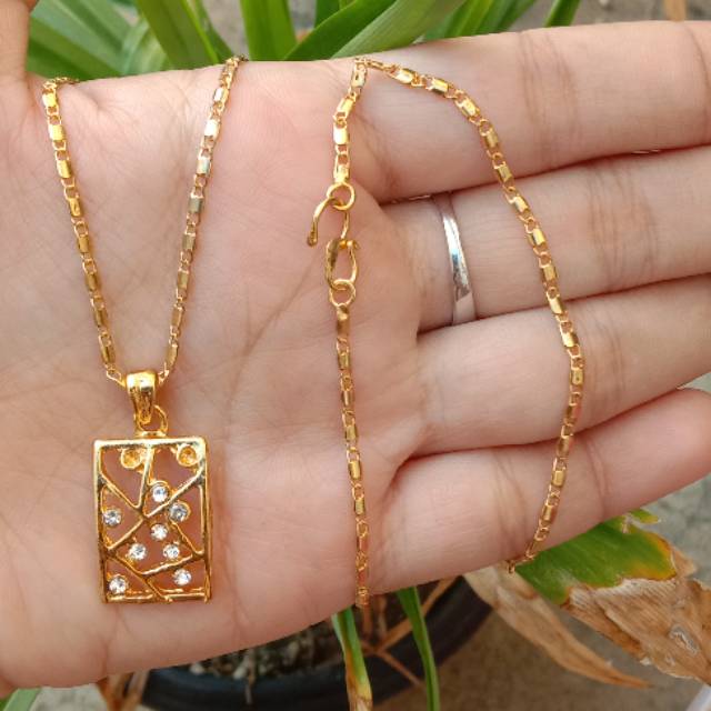 kalung berbahan dasar koin uang 1991