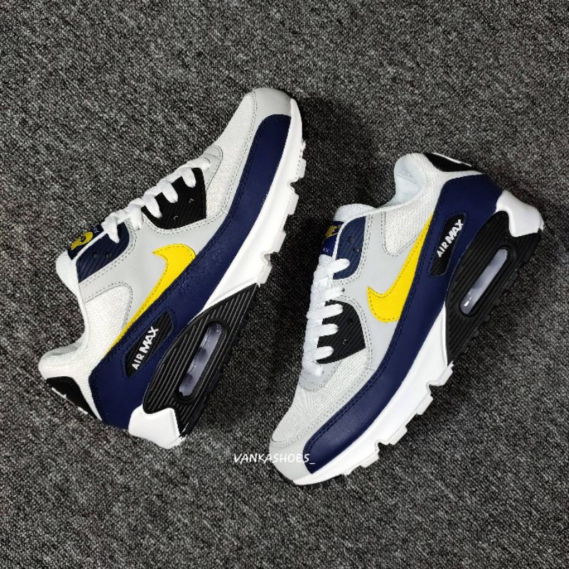 yellow and navy blue air max