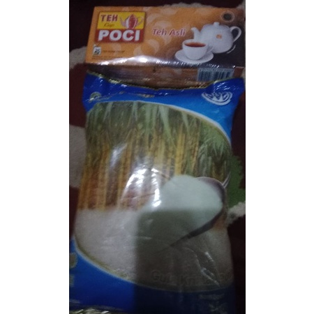 

Teh poci plus gula pasir Sus 1 kg