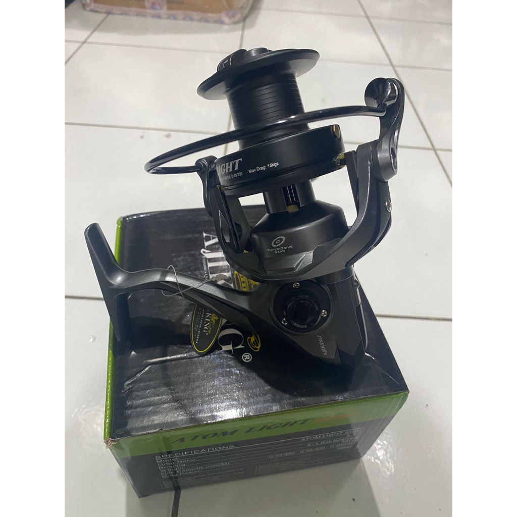 Reel Pancing Spinning Ajiking Atom Light Surf Max Drag 15Kg Warna Hitam