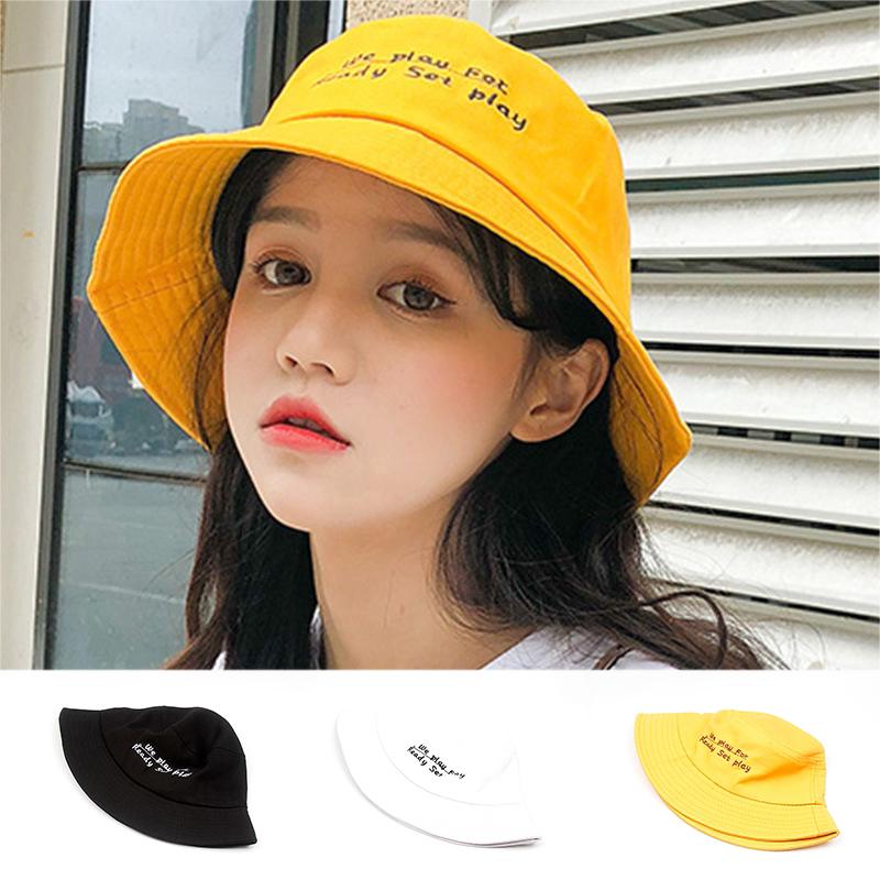 wide brimmed yellow hat