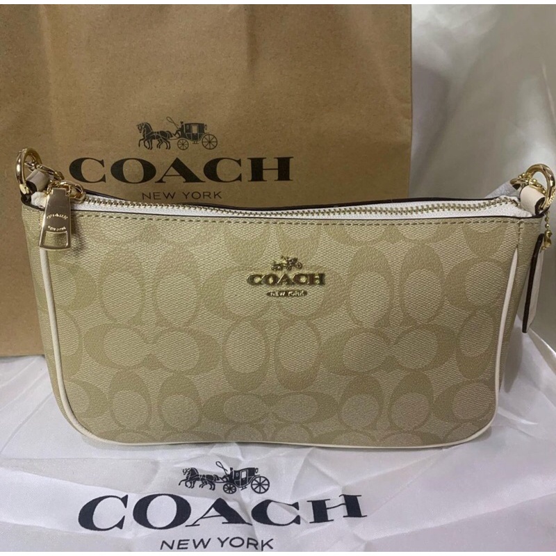 TOP HANDLE COACH