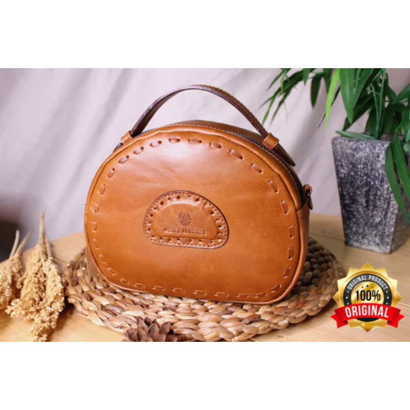 Tas kulit asli rajut- pouch bag fasion wanita