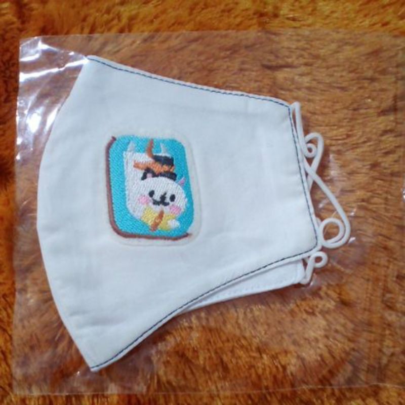 

Masker Kain gambar kucing baca buku