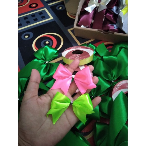 

Aplikasi pita jadi / pita souvenir lebar 2,5 cm