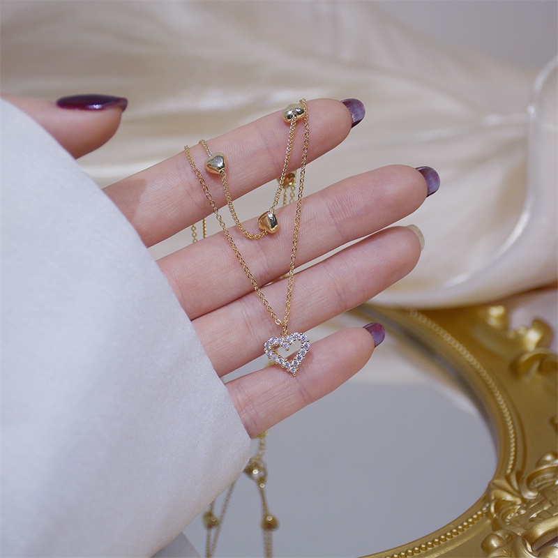 Kalung Rantai Klavikula Hias Liontin Hati Kristal Lapisan Ganda Bahan Logam Gaya Vintage Korea Untuk Wanita
