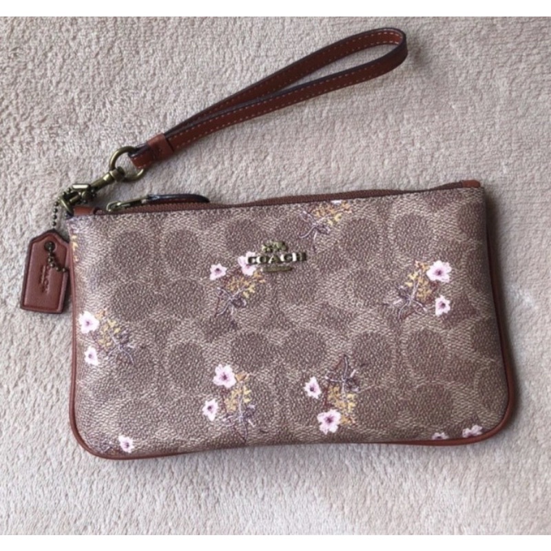 Coach Small Wristlet In Signature Canvas With Floral Bow Print (F67070)