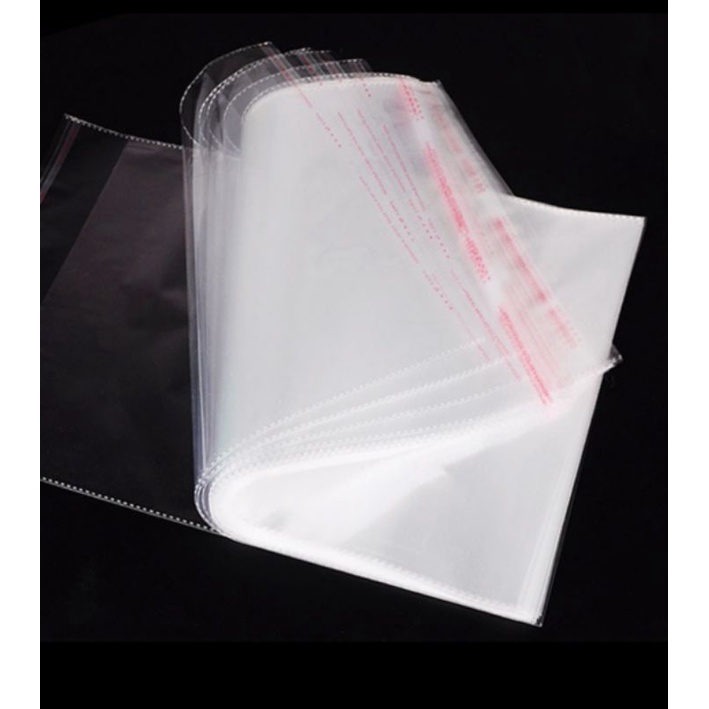 

PLASTIK BAJU PKE LEM UKURAN 25X30 isi 50