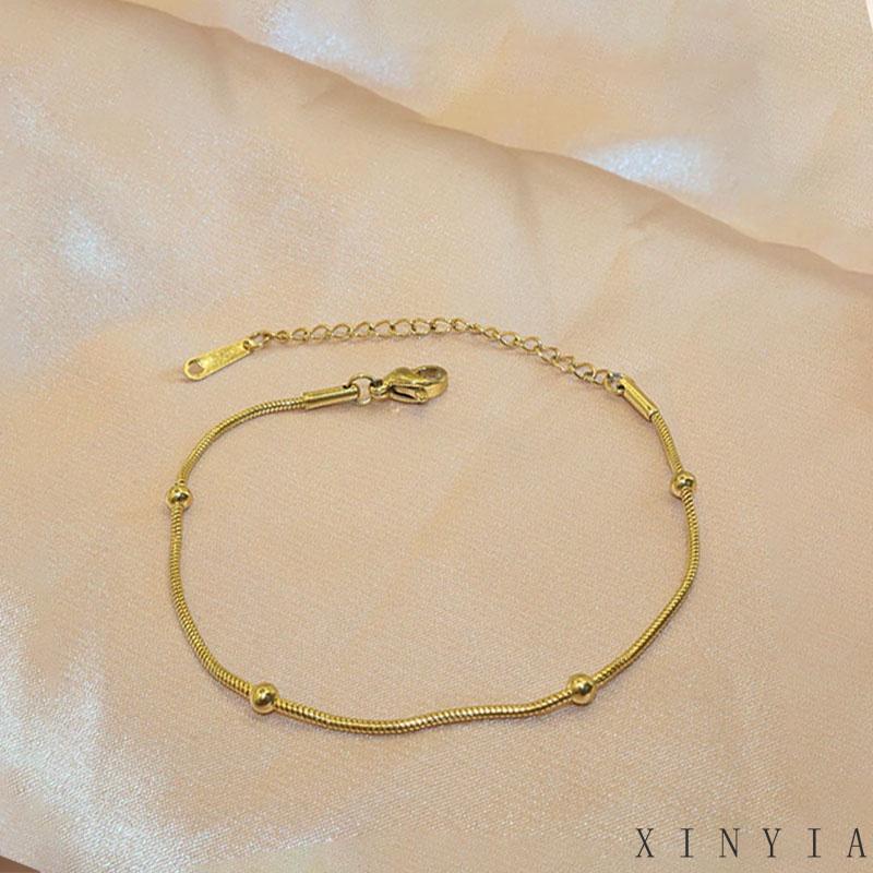 Xia.id Gelang Tangan Titanium Steel Desain Tulang Ular Hias Manik Bulat Untuk Wanita