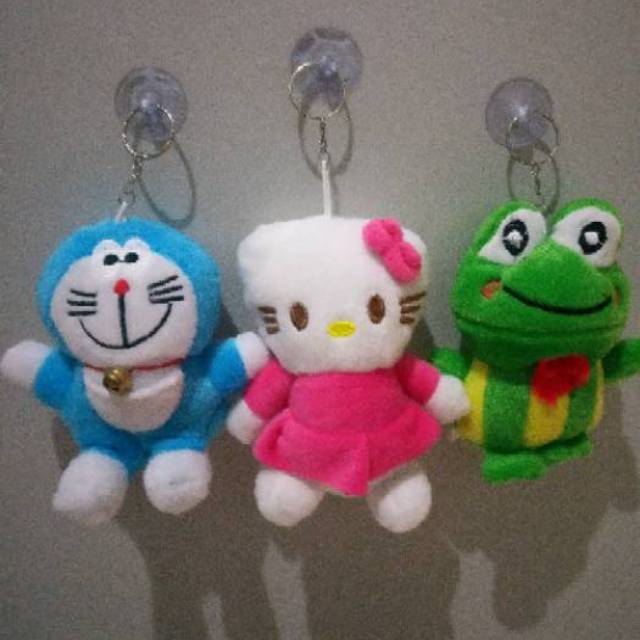 Boneka SNI doraemon tempel kaca mobil