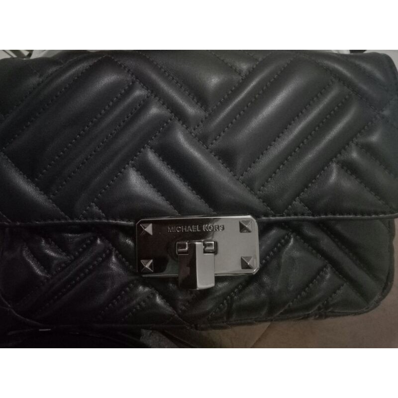 Mk peyton shoulder flap med