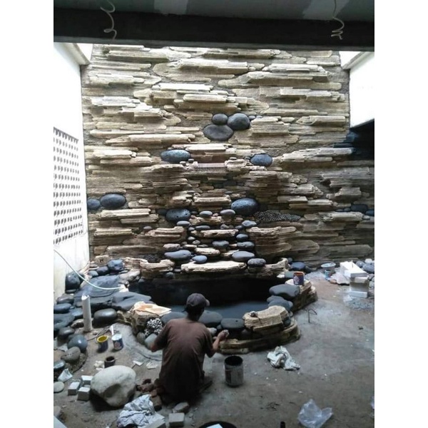 kolam relif tebing air terjun