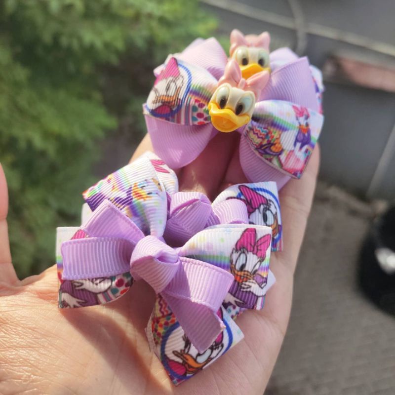 

pita daisy duck ungu