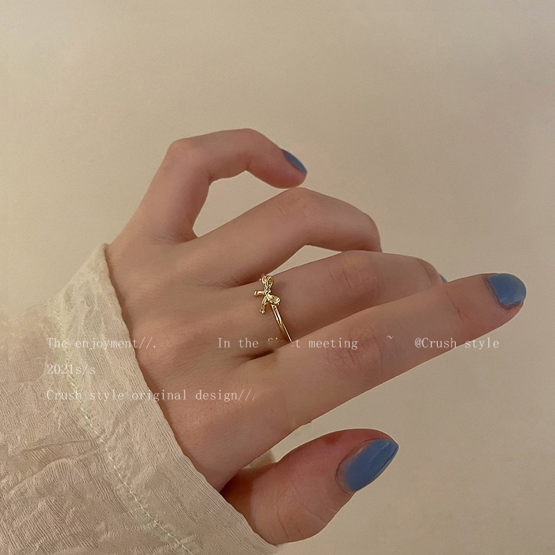 Cincin Model Terbuka Bahan Alloy Lapis Emas Desain Pita Untuk Wanita