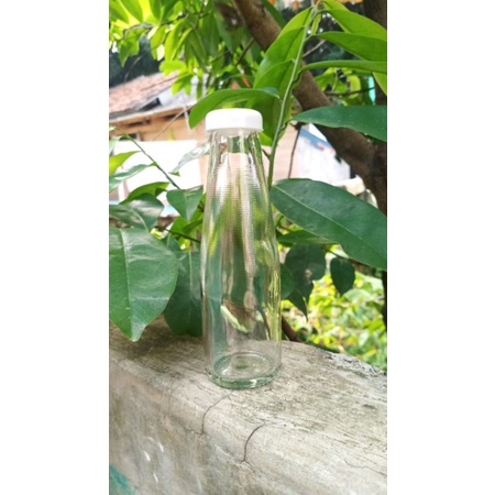 Botol kaca bening 100 ml tutup plastik kedap