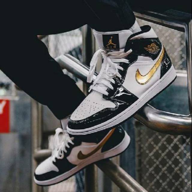 jordan 1 mid patent black white gold on feet