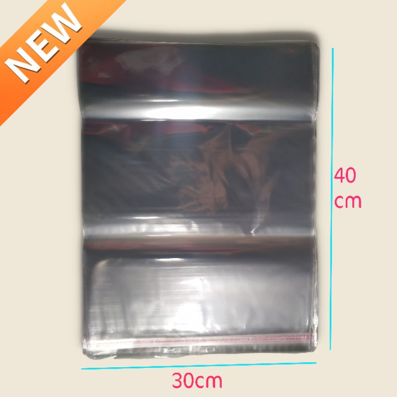 

Plastik Bungkus Baju OPP lem 30x40 cm