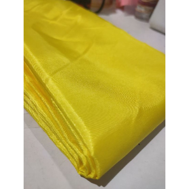 bahan kain satin peles saten kuning terang kenari furing dekor dekorasi yard gulungan murah foto