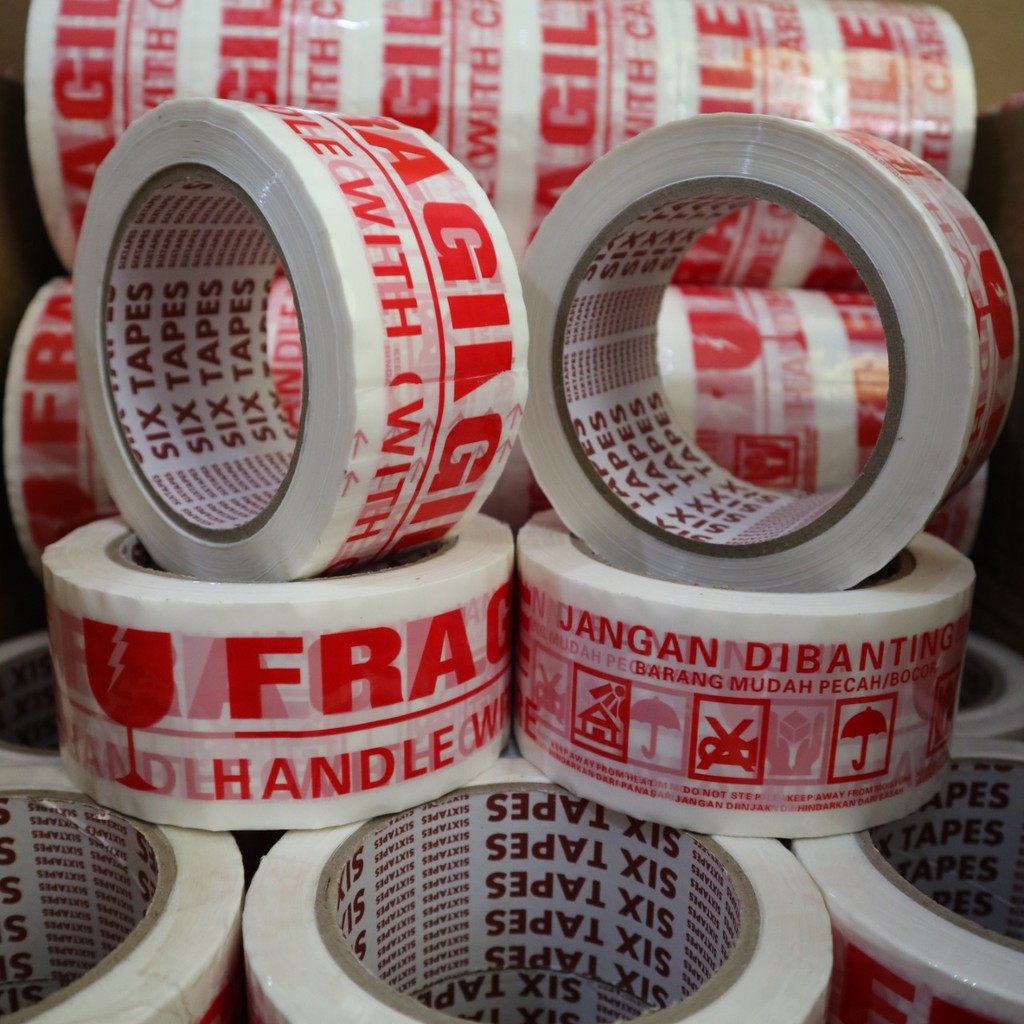 LAKBAN FRAGILE MERAH PUTIH LAKBAN JANGAN DIBANTING Merk Six Tapes tebal berkualitas Ukuran Pasti Pas