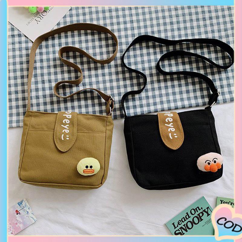 COD❤️ Tas Kanvas Wanita Messenger Tas Kecil Gadis Mahasiswa Kartun Lucu Tas Kanvas Bahu-A.one