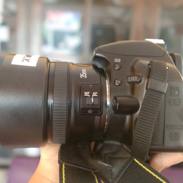 Nikon d3100 with lensa fix yn 35mm f2N
