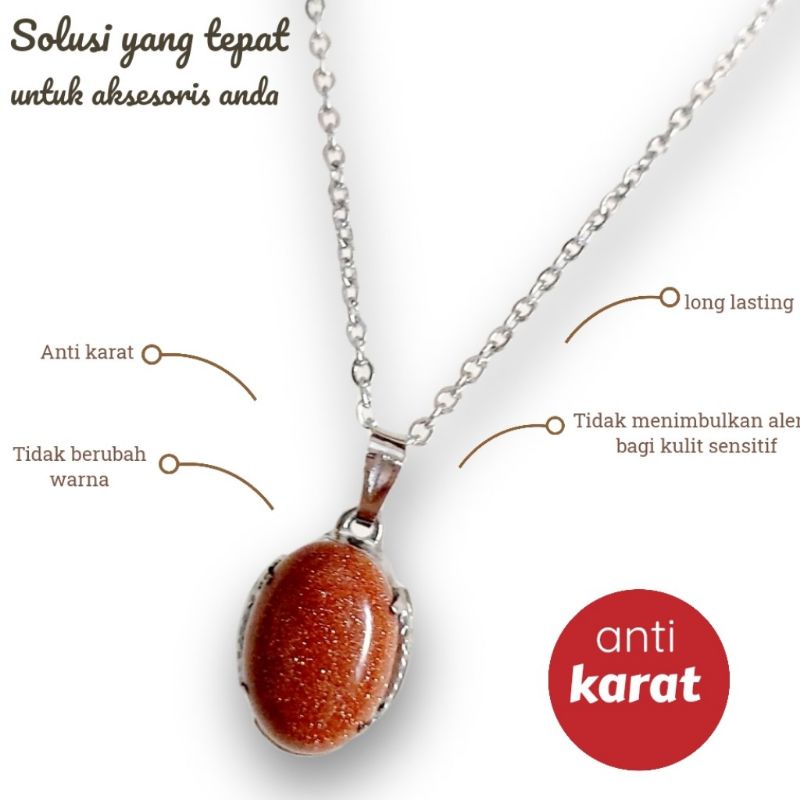 KALUNG TITANIUM LIONTIN MONEL MATA MERAH TALI AIR