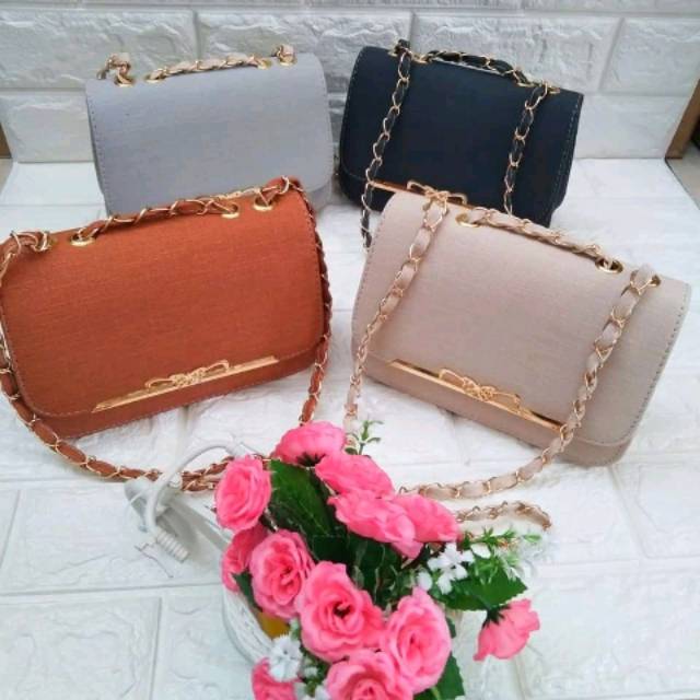 

Tas behel pita motif kayu