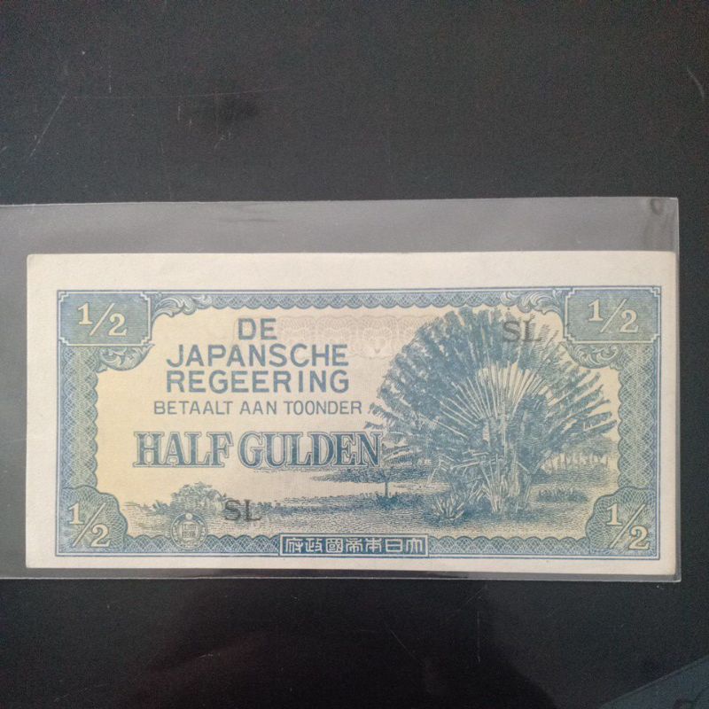uang kuno 1/2 gulden djr error cetak geser.